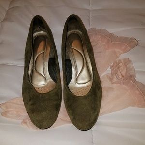 Gentlely worn Gray suede shoes.